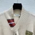 2025  Miu Miu Women's Striped Knit Polo Sweater with a Quarter-Zip or Button Placket and Miu Miu Logo #A54839